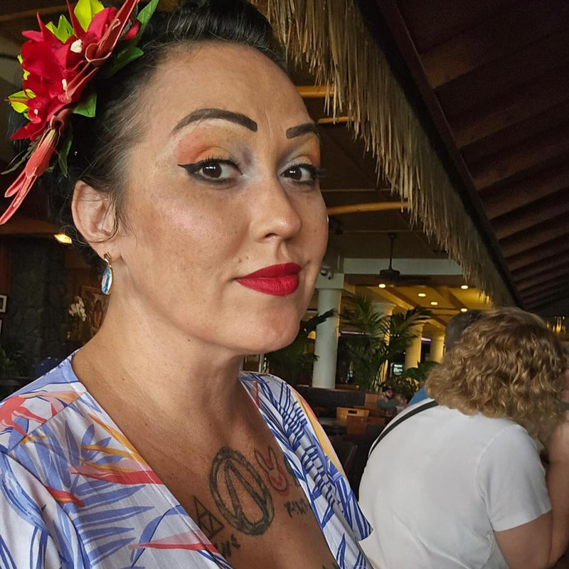 Women wearing Makanalani wrap dress in a tiki bar