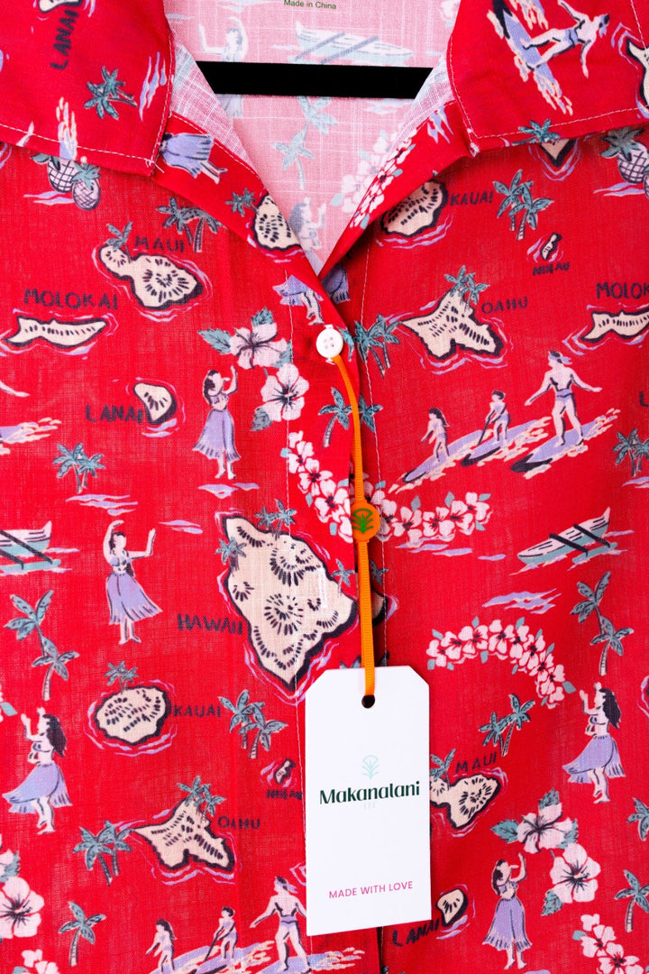 Red swim cover-up with vintage-style print and 'Makanalani' tag