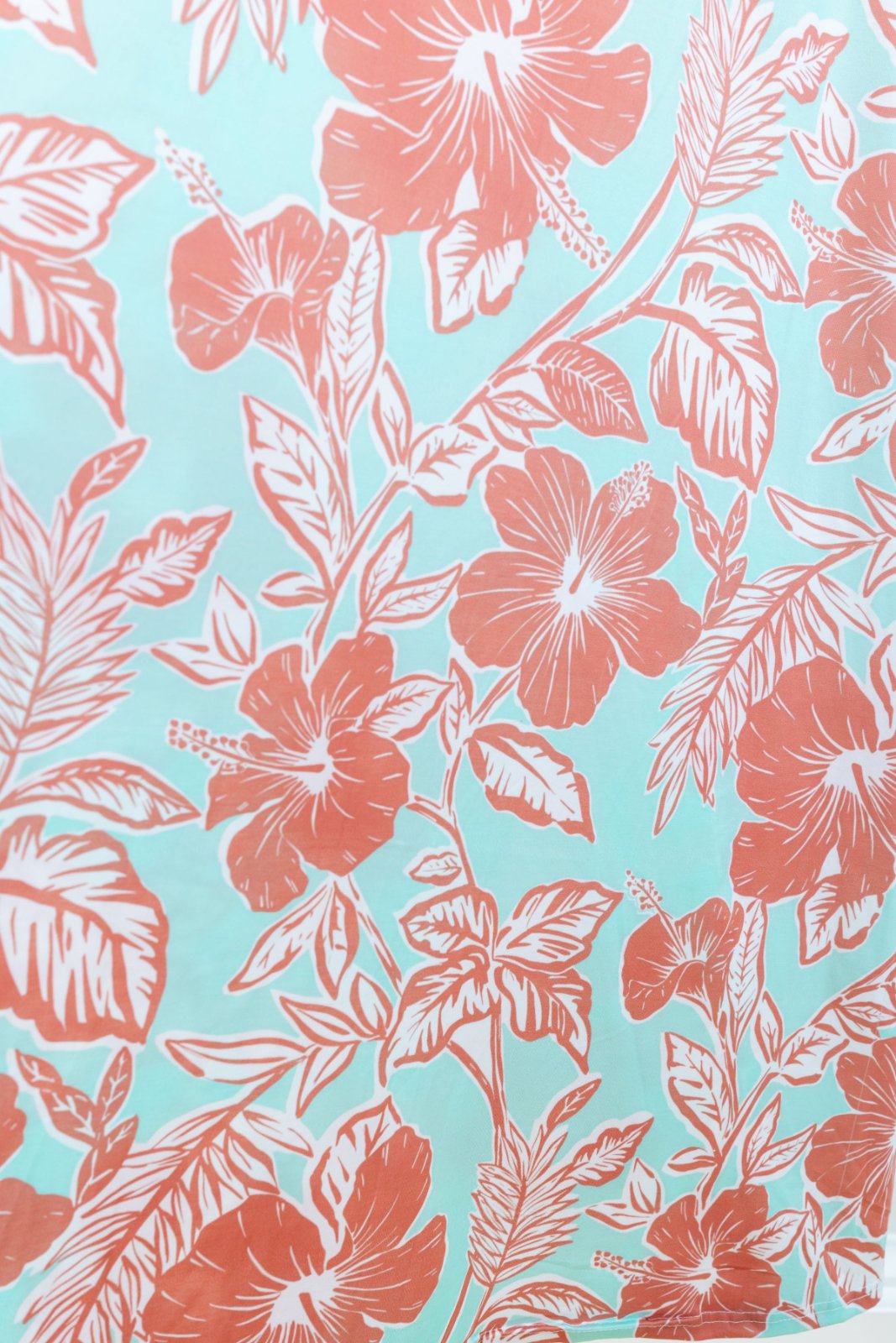 Floral pattern with pink flowers and leaves on a turquoise background