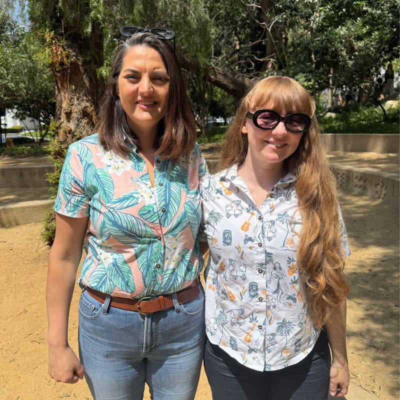 Two women wearing Makanalani aloha shirts