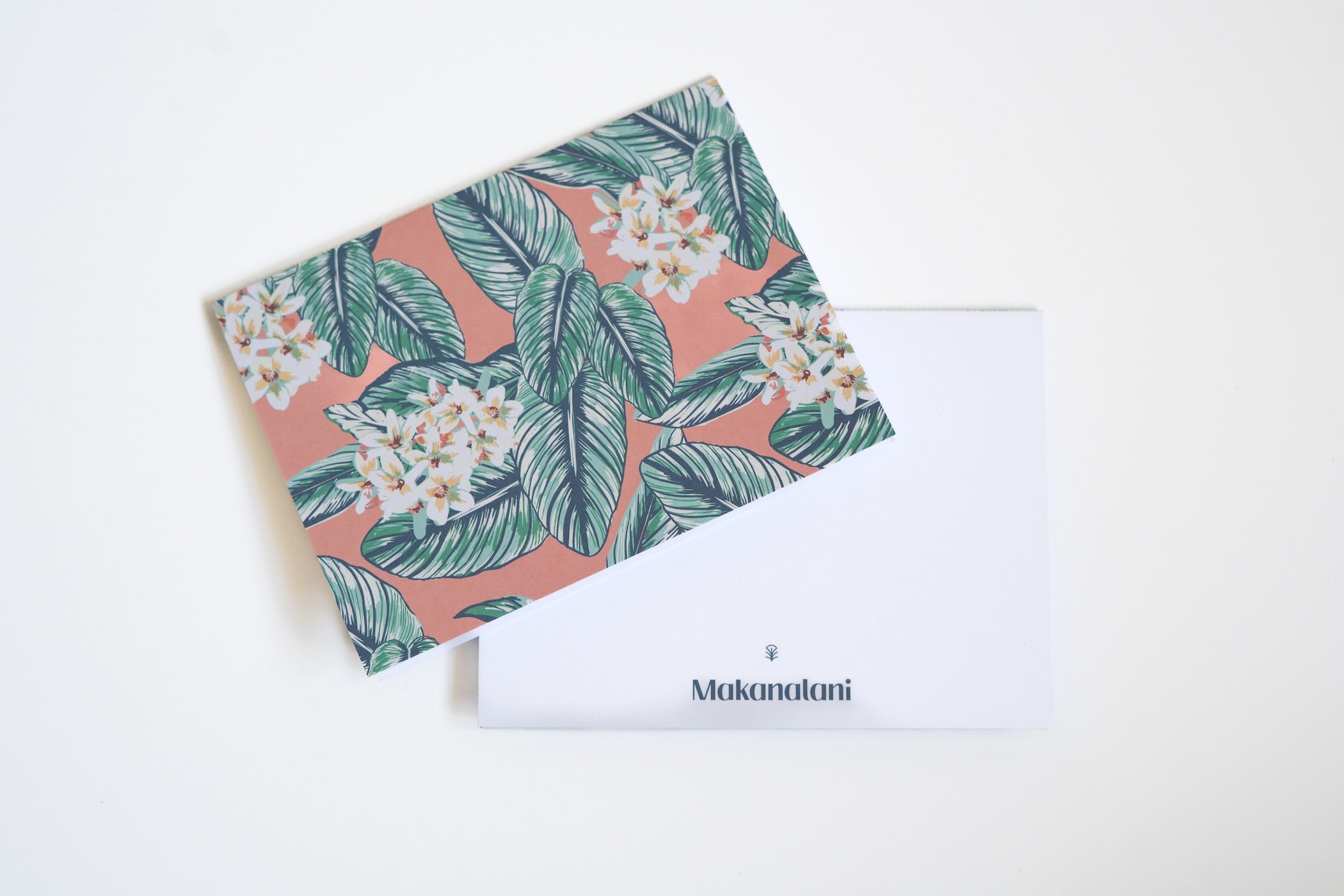 Multi-colored notecard by Makanalani with palm leaves and white flowers