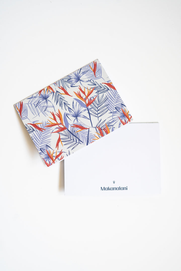 Multi-colored notecard by Makanalani with a birds of paradise print on a white background