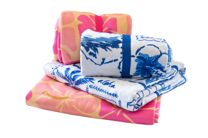 Set of colorful towels with floral patterns on a white background