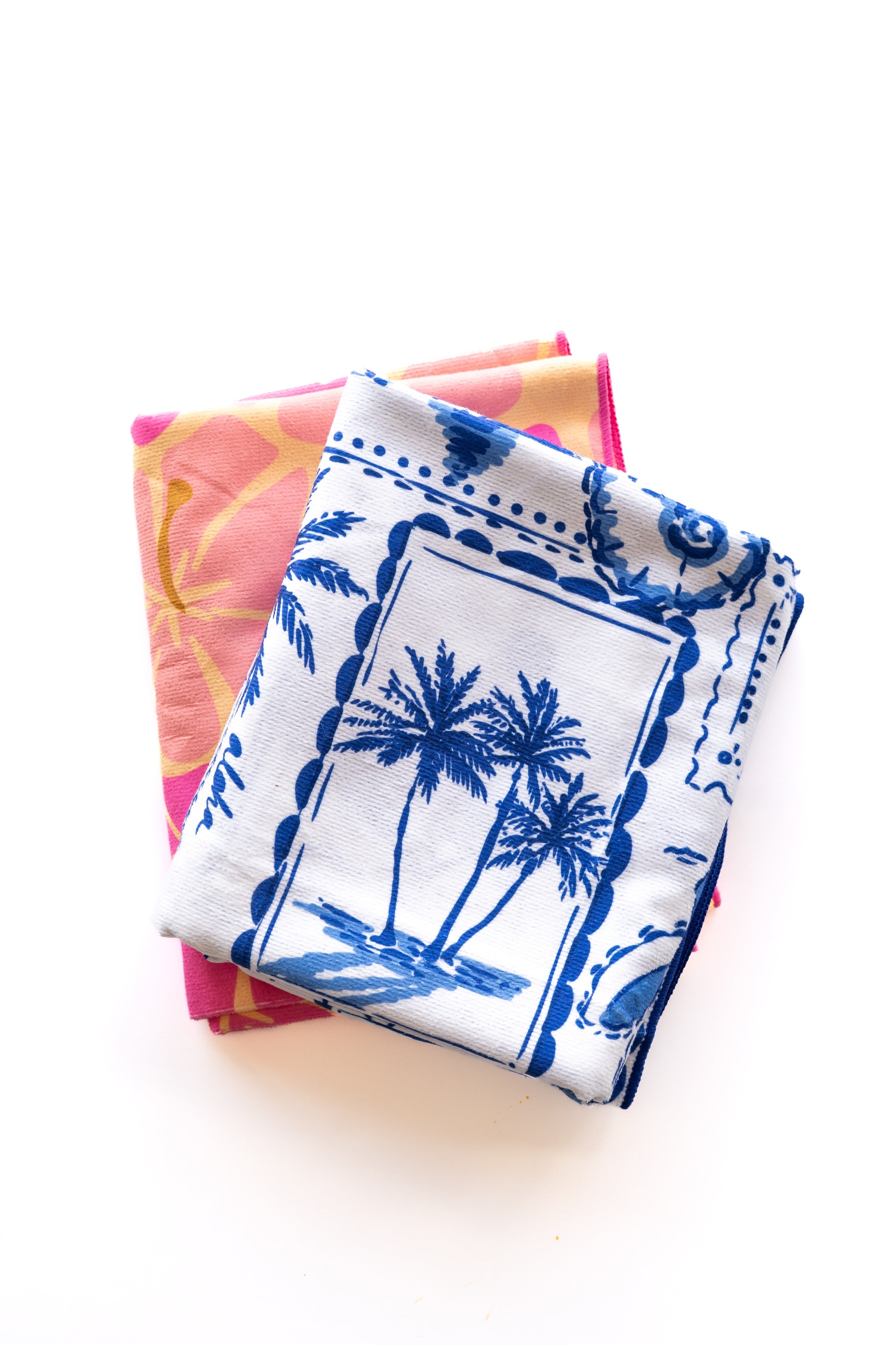 Set of colorful towels with floral patterns on a white background