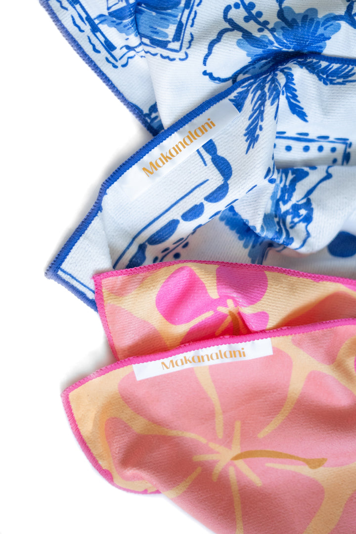Set of colorful towels with floral patterns on a white background