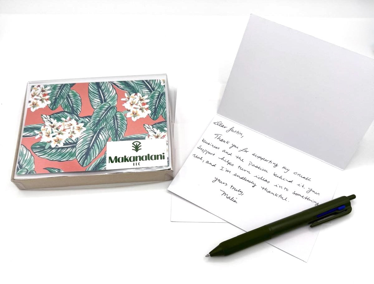 Example of hand written card next to the packaged version of the ten notecard set